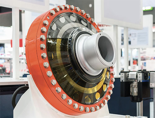photo of a rotating industrial machine filled with lubrication and on a table in an engineering lab