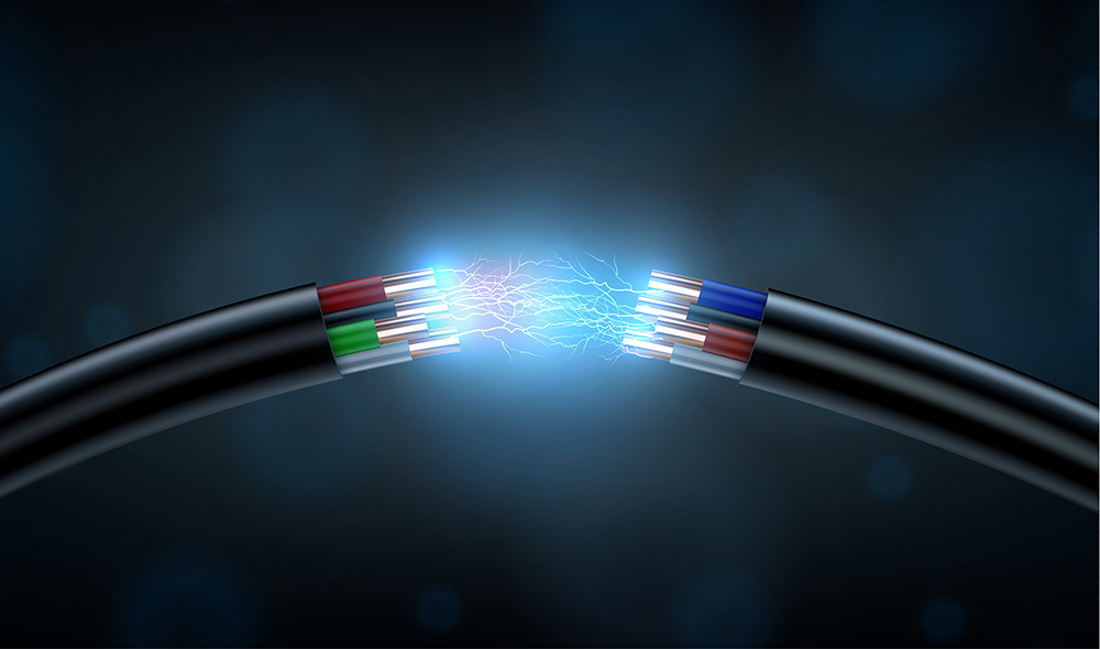 two black cables with exposed wires and electrical spark
