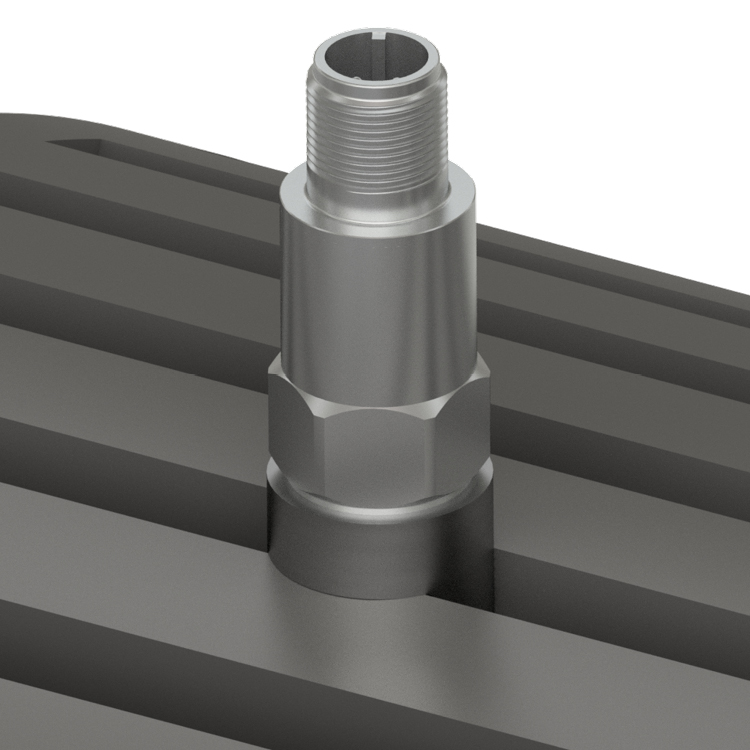 Close-up of a CTC standard size, top exit accelerometer mounted on an industrial motor with a CTC motor fin mount pad.